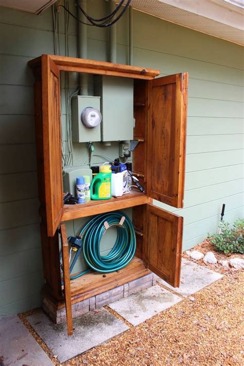 how to hide electrical boxes on outside of house|how to hide water boxes.